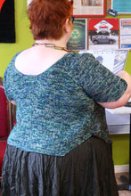 Load image into Gallery viewer, back view of Kim wearing Bumbletee.The back of the sweater has a deep scoop neckline
